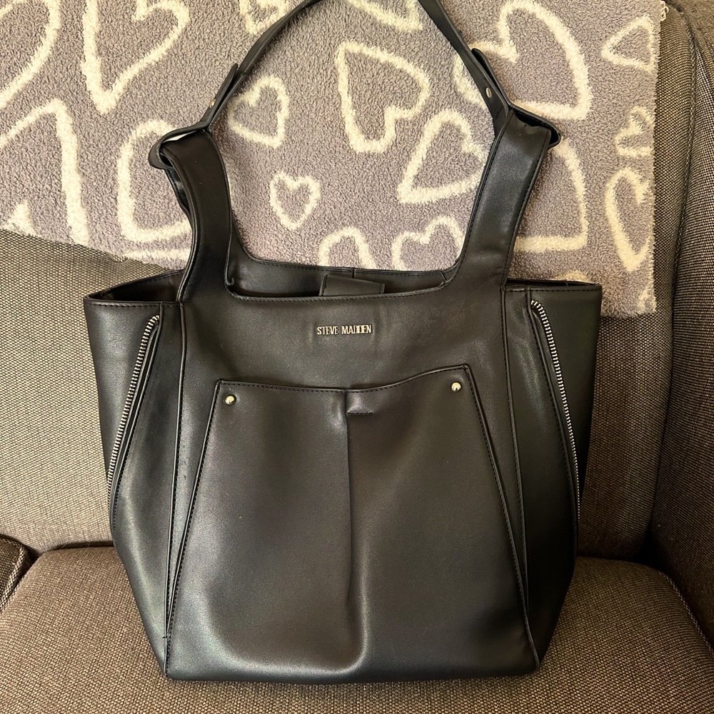 Steve Madden black faux leather with zipper on each side to expand purse